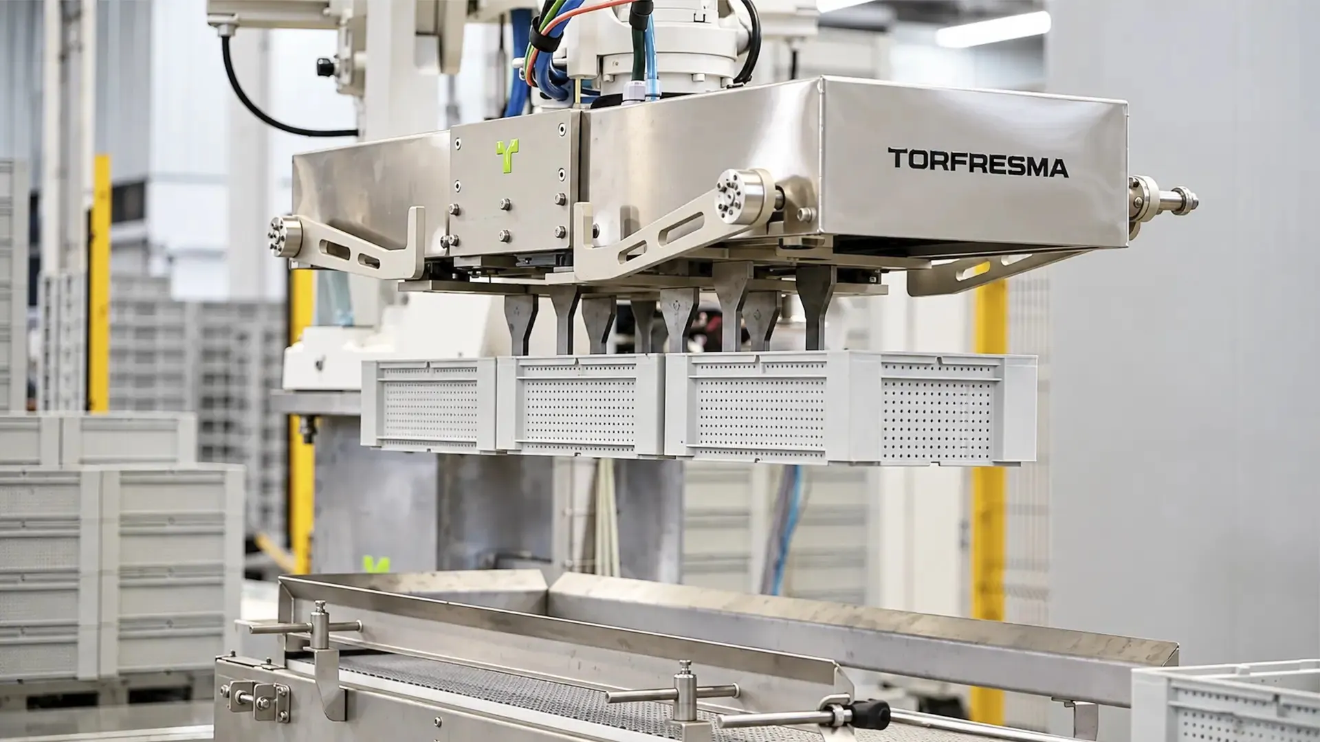 Co-packer palletizing automation: TRFCobot collaborative robot palletizing cases beside its infeed conveyor.