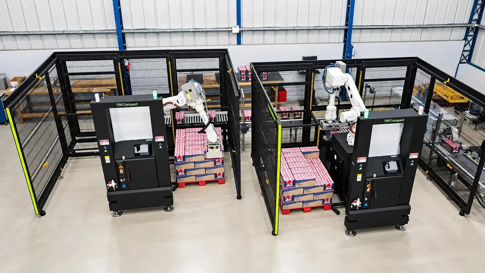 TRFCompact palletizing cartons of packaged product beside a secondary packaging line.
