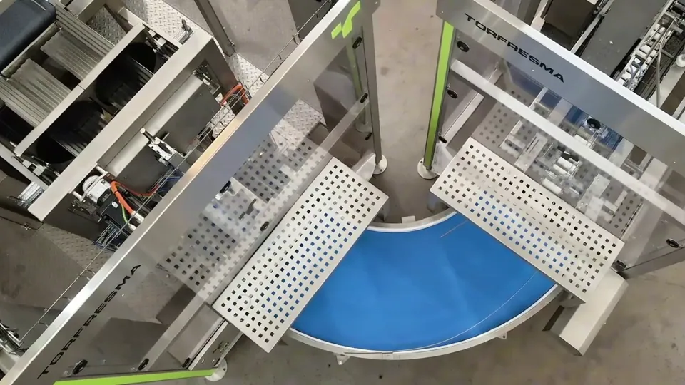 Two TRFDroppack machines with the curved infeed conveyor