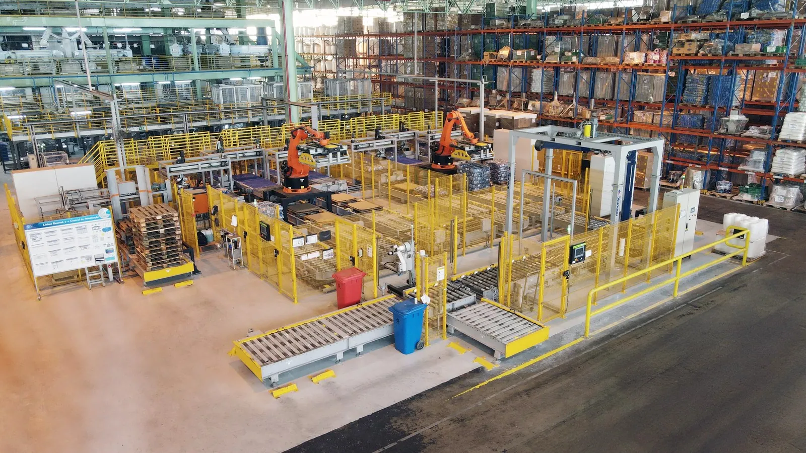 TRFSpeed palletizing cells side by side in a large plant, handling several lines.