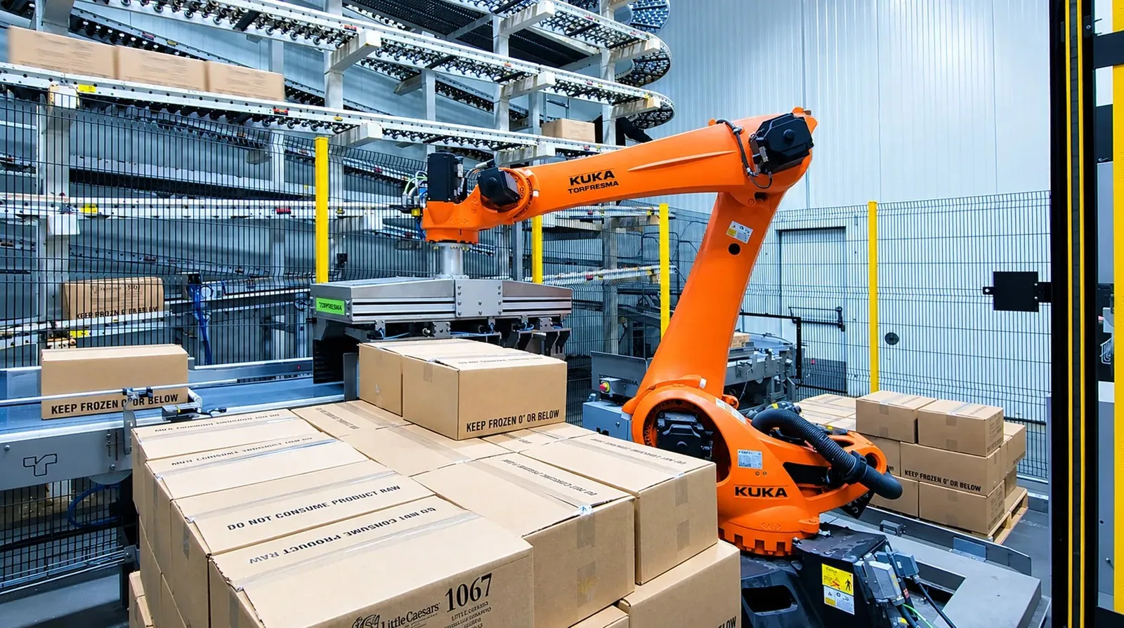 TRFSubzero KUKA robot building a pallet of frozen cases marked keep frozen at Custom Foods.